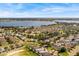 Aerial view of community with large lake and well-manicured lawns at 2824 Attwater Loop, Winter Haven, FL 33884