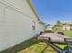 A home's backyard with a trailer and green grass at 31 Wagon Cir, Kissimmee, FL 34743