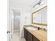 Bathroom sink and countertop, with decorative mirror and view to shower at 31 Wagon Cir, Kissimmee, FL 34743