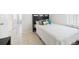 Bedroom featuring a bed with decorative pillows, a window and tile flooring at 31 Wagon Cir, Kissimmee, FL 34743