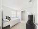 Light-filled bedroom featuring tile floors, a window, and a closet at 31 Wagon Cir, Kissimmee, FL 34743