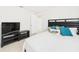 Bright bedroom with a large bed, TV, and view to ensuite bathroom at 31 Wagon Cir, Kissimmee, FL 34743