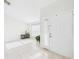 Welcoming entryway featuring neutral tile floors, a window, and ample natural light at 31 Wagon Cir, Kissimmee, FL 34743