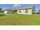 Charming single story home with a well-maintained lawn and beautiful landscaping at 31 Wagon Cir, Kissimmee, FL 34743