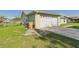 Attached garage with driveway and fenced in backyard at 31 Wagon Cir, Kissimmee, FL 34743