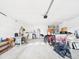 Garage needing clean up offering lots of space for parking and storage, also washer and dryer hookups at 31 Wagon Cir, Kissimmee, FL 34743