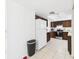 View of kitchen featuring stainless steel appliances, and wooden cabinets at 31 Wagon Cir, Kissimmee, FL 34743