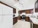 Functional kitchen featuring stainless steel appliances, and wooden cabinets at 31 Wagon Cir, Kissimmee, FL 34743