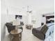 Bright living room featuring neutral walls, tile floors, ceiling fan and modern furnishings at 31 Wagon Cir, Kissimmee, FL 34743