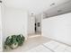 Spacious living area with tile floors, neutral paint, and seamless flow at 31 Wagon Cir, Kissimmee, FL 34743