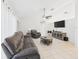 Comfortable living room with tile flooring, ceiling fan and modern furnishings at 31 Wagon Cir, Kissimmee, FL 34743
