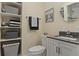 Clean bathroom with modern fixtures, vanity and shelving at 326 Canal Dr, Lake Wales, FL 33859