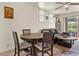 Open concept dining area with wood table and chairs near a comfortable living room at 358 1St N Ave, Lake Wales, FL 33859