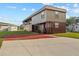 Two-story home with upper deck, ground-level covered parking, and concrete driveway at 358 1St N Ave, Lake Wales, FL 33859