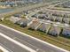 Overhead view of a neighborhood featuring a modern home, close to a main road and community waterways at 3821 Giorgio Dr, Winter Haven, FL 33884