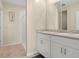 Bathroom with double sinks, stone countertops and tiled shower at 3821 Giorgio Dr, Winter Haven, FL 33884