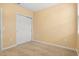 Cozy bedroom with a closet, neutral walls, and carpeted flooring at 3821 Giorgio Dr, Winter Haven, FL 33884