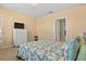 Bedroom with carpeting, ceiling fan, dresser and ensuite bath access at 3821 Giorgio Dr, Winter Haven, FL 33884