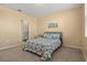 Bedroom with carpet flooring, ceiling fan, and ensuite bathroom access at 3821 Giorgio Dr, Winter Haven, FL 33884