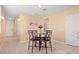 Cozy dining area with a round table, four chairs, and neutral walls that create an inviting atmosphere at 3821 Giorgio Dr, Winter Haven, FL 33884
