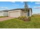 Attractive single Gathering home with beautiful front yard landscaping and a 2-car garage at 3821 Giorgio Dr, Winter Haven, FL 33884