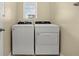 Laundry room with side-by-side washer and dryer and overhead window at 3821 Giorgio Dr, Winter Haven, FL 33884