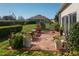 View of backyard patio area with potted plants, greenery, and outdoor furniture at 3834 Bedford Ave, Winter Haven, FL 33884