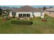 Backyard with a spacious lawn, patio, and neatly trimmed hedges at 3834 Bedford Ave, Winter Haven, FL 33884
