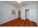 Bright bedroom with wood floors, closet and white doors at 3834 Bedford Ave, Winter Haven, FL 33884