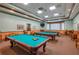 A billiard room at the Traditions clubhouse featuring billiards tables and seating at 3834 Bedford Ave, Winter Haven, FL 33884