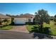 Charming single-story home featuring a brick driveway, well-manicured lawn, and a two-car garage at 3834 Bedford Ave, Winter Haven, FL 33884