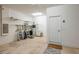Bright garage with ladders, storage shelves, and access door at 3834 Bedford Ave, Winter Haven, FL 33884