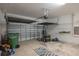 View of the spacious garage with an automatic door and a large gray and white rug at 3834 Bedford Ave, Winter Haven, FL 33884
