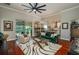 Stylish living room with hardwood floors, chic decor, and an open view to the kitchen at 3834 Bedford Ave, Winter Haven, FL 33884