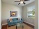 Cozy living room with natural light, wood floors, comfortable blue sofa, and decorative pillows at 3834 Bedford Ave, Winter Haven, FL 33884