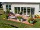 Patio with bench, table and chairs and mature landscaping at 3834 Bedford Ave, Winter Haven, FL 33884