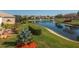 Scenic view of the pond and lush landscaping in the community at 3834 Bedford Ave, Winter Haven, FL 33884
