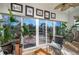 Inviting sunroom with tile flooring, comfortable seating, potted plants, and large windows offering an outdoor view at 3834 Bedford Ave, Winter Haven, FL 33884
