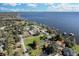 Aerial view showcasing lakefront homes with private docks, beautiful landscaping, and stunning water views at 3943 Chambers St, Lake Wales, FL 33898