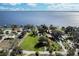 Aerial view of waterfront homes with private docks in a lush green setting at 3943 Chambers St, Lake Wales, FL 33898