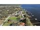 A stunning aerial view of waterfront homes along the lake featuring private docks at 3943 Chambers St, Lake Wales, FL 33898