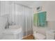 Cozy bathroom features a pedestal sink and shower at 3943 Chambers St, Lake Wales, FL 33898