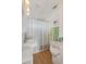 Cozy bathroom features a sleek white vanity with stylish fixtures and a tub with a clean, modern shower curtain at 3943 Chambers St, Lake Wales, FL 33898