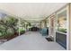 Relax on the covered patio with a bench, offering a cozy outdoor space with views of the landscaped surroundings at 3943 Chambers St, Lake Wales, FL 33898