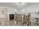 Bright dining area with glass top table and wicker chairs in an open space at 3943 Chambers St, Lake Wales, FL 33898