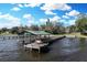 This private boat dock is perfect for fishing, boating, or relaxing by the water, with a covered area for shade at 3943 Chambers St, Lake Wales, FL 33898