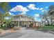 Lovely home with covered outdoor space, mature trees, and a well-maintained lawn at 3943 Chambers St, Lake Wales, FL 33898