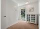 Hallway leads to an outdoor view and features a display cabinet at 3943 Chambers St, Lake Wales, FL 33898