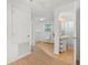 Hallway leading to bathroom and bedroom, with a pedestal sink in view at 3943 Chambers St, Lake Wales, FL 33898