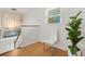 Bright landing with a window, modern lighting, and minimalist decor at 3943 Chambers St, Lake Wales, FL 33898